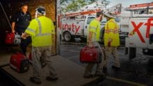 Xfinity technicians load a truck with supplies