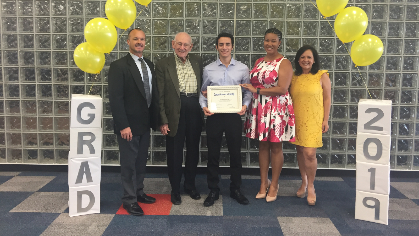 Robert Handy of Miami, Miami-Dade County Public Schools is presented with a scholarship.