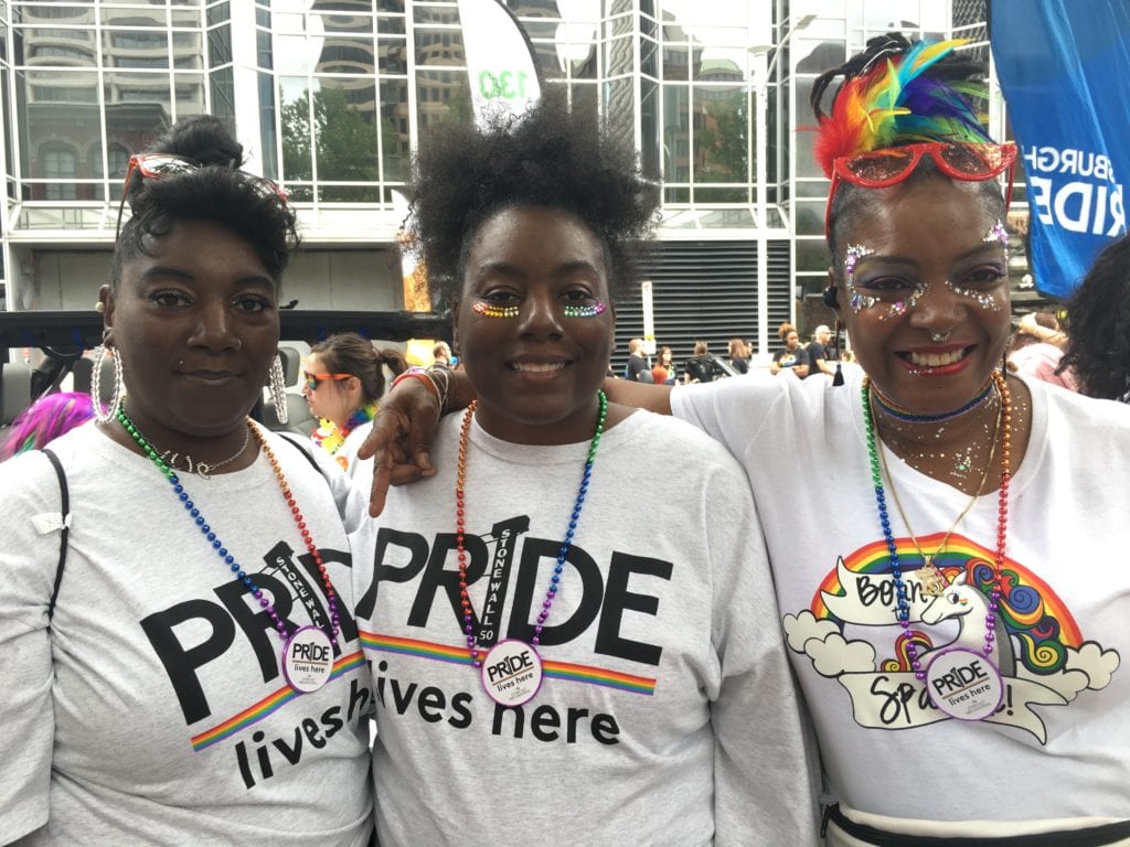 Comcast employees wearing "Pride lives here" t-shirtsat Pittsburgh Pride