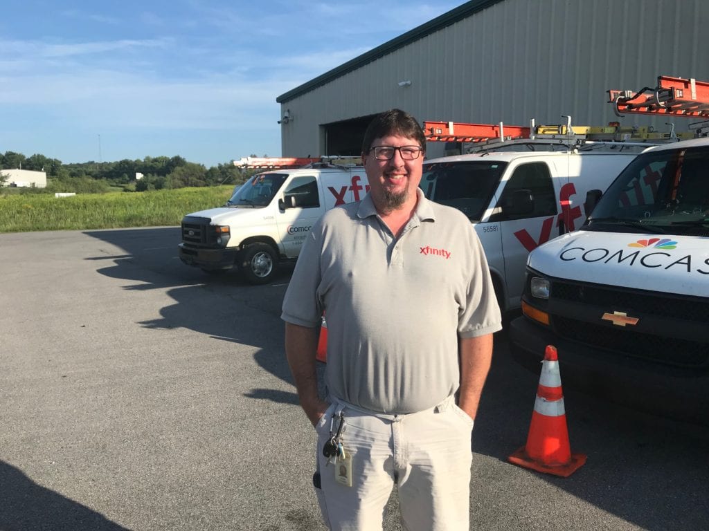 Man in front of his truck