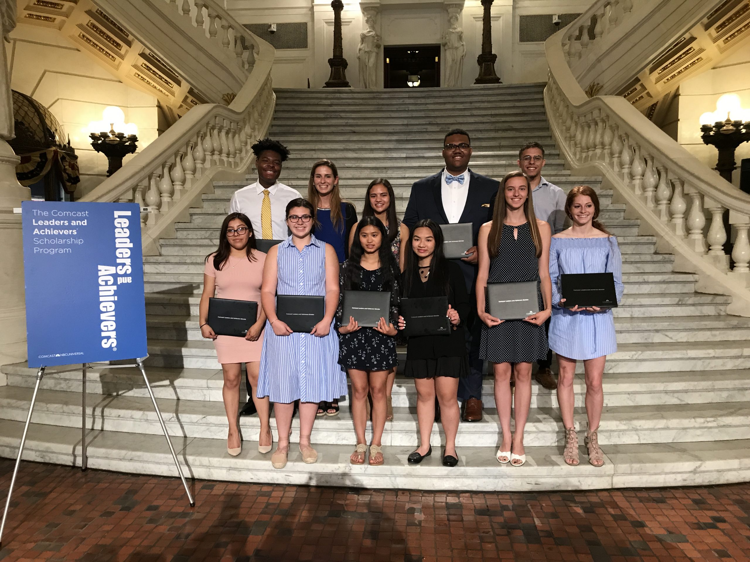 Students who won Comcast scholarships standing on Pennsylvania Capitol steps
