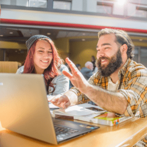 two people looking at laptop