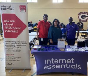 People at Internet Essentials booth