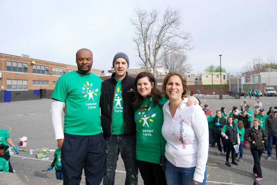 Comcast's three leads for Adaire's Comcast Cares Day project (l to r) from left, Chris Powell, Ryan Olah and Ali Porreca -- pose with Adaire Principal Anna Jenkins, right
