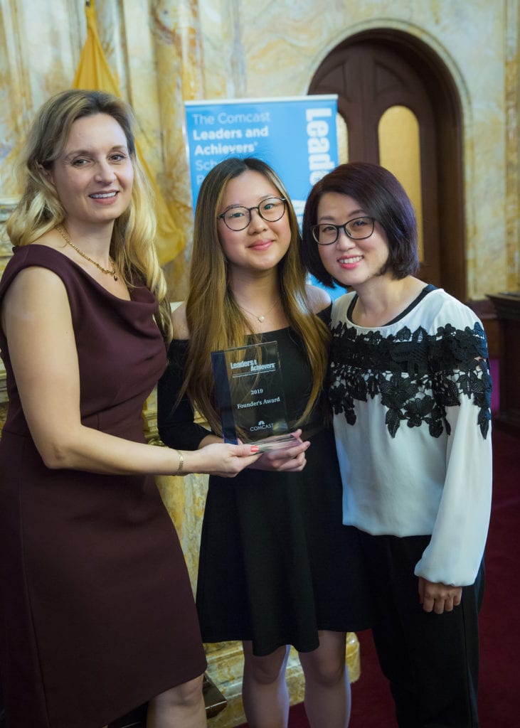 Three women with an award