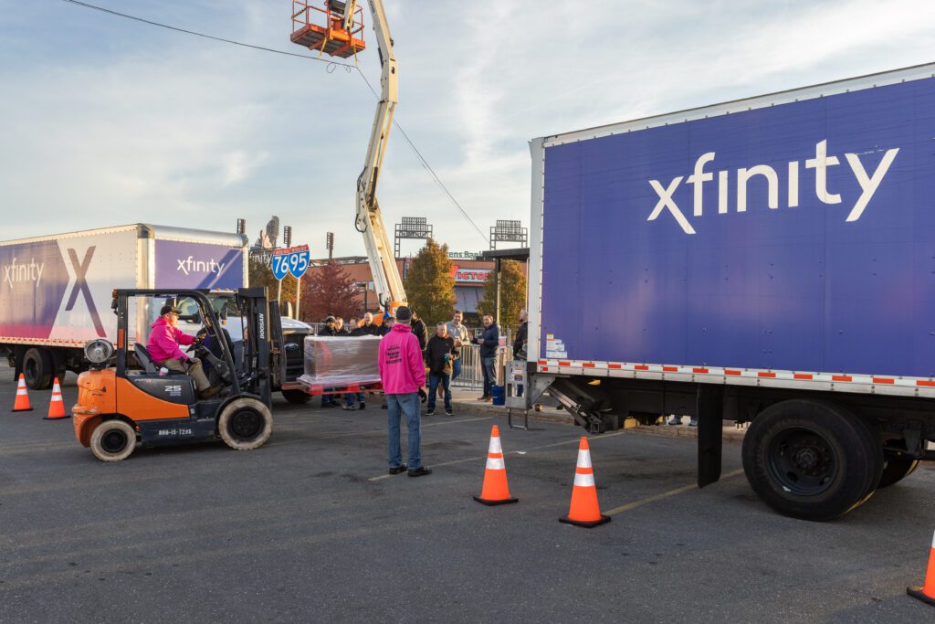 Xfinity Box Trucks being unloaded at Camp Out for Hunger 2023
