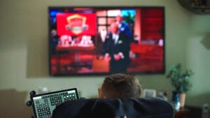 Disabled man watching eye control TV