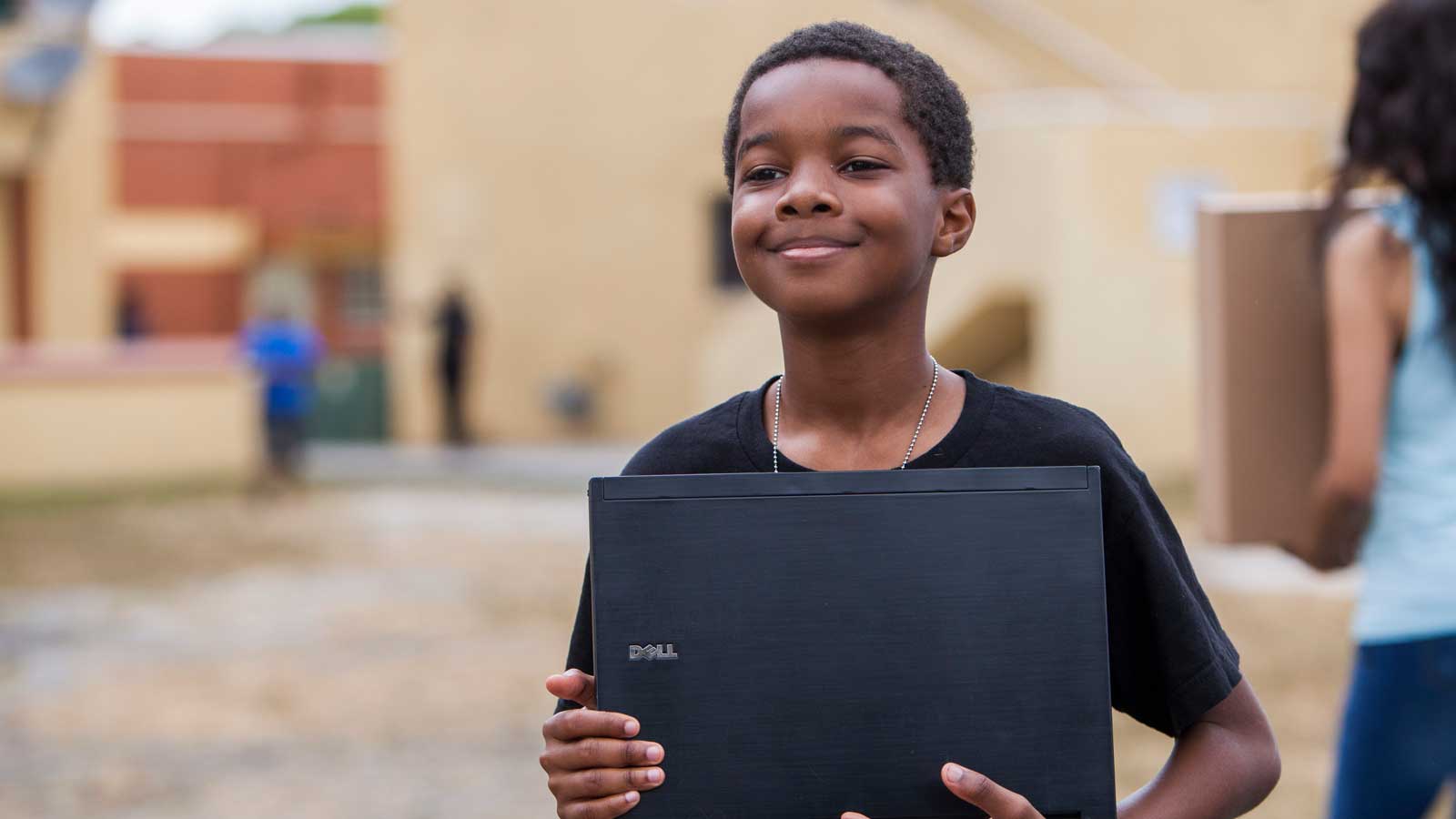 Boy holding laptop