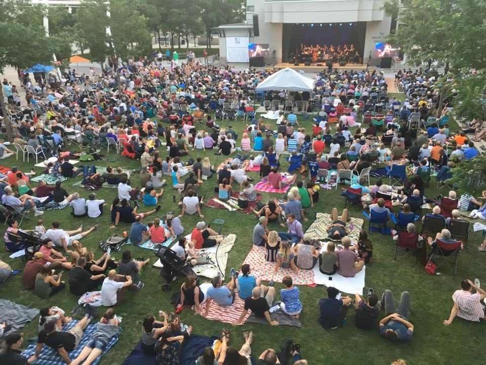 People sitting on blankets at the Utah Black Chamber Summer BBQ.