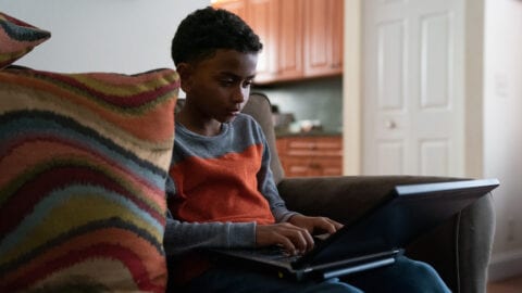 Internet Essentials boy using a laptop