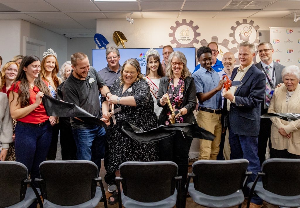 People cutting a ribbon during the soft launch of the Comcast Digital Literacy Center at the Eagle Mountain Chamber of Commerce on Thurs., April 25, 2024 in Eagle Mountain, Utah.