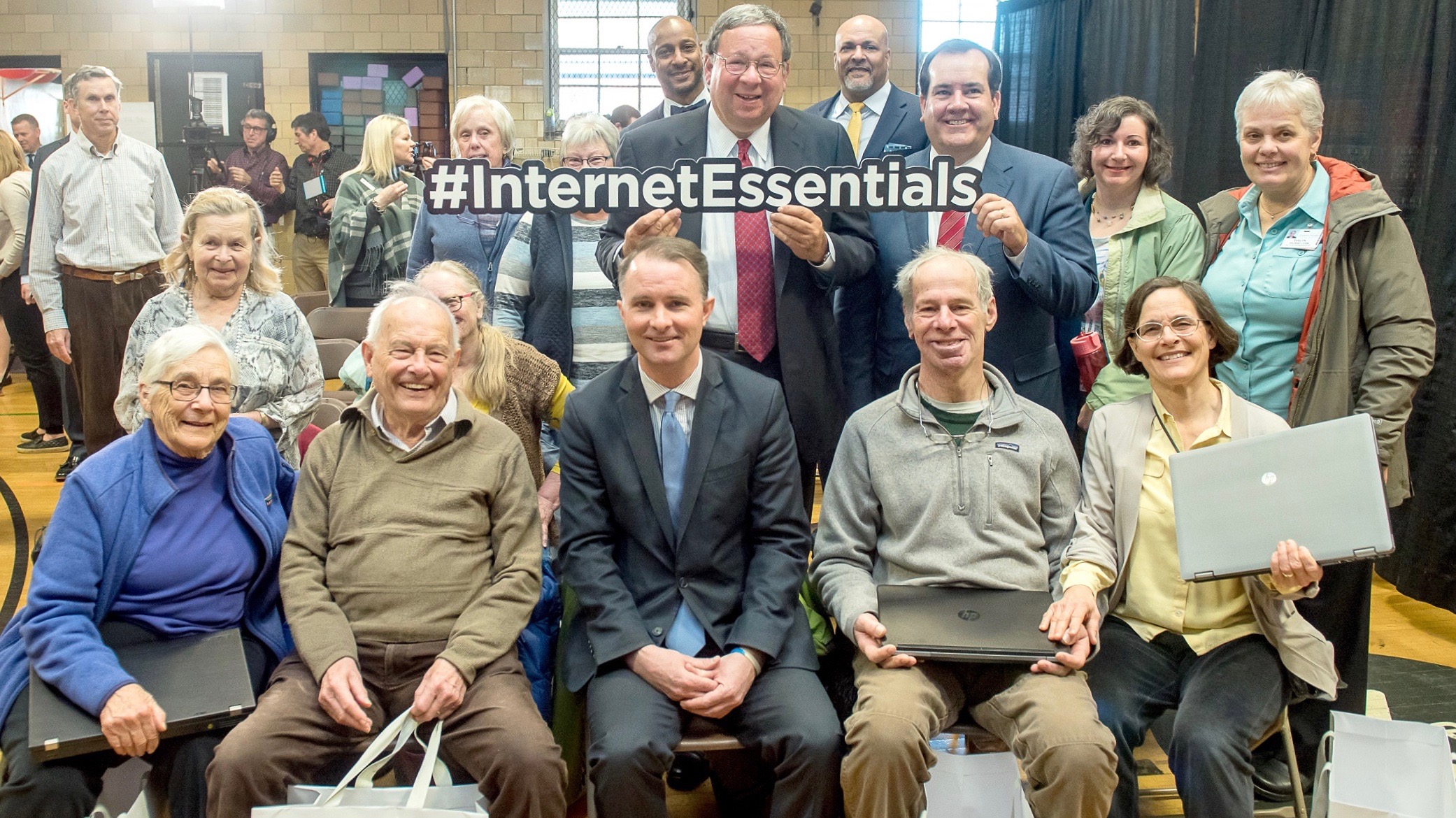 David L. Cohen, Comcast Corporation’s Senior Executive Vice President and Chief Diversity Officer, stands with a group of senior Internet Essentials recipients.