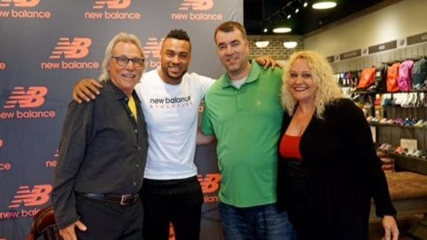 Elias Diaz with Comcast employees at autograph signing event