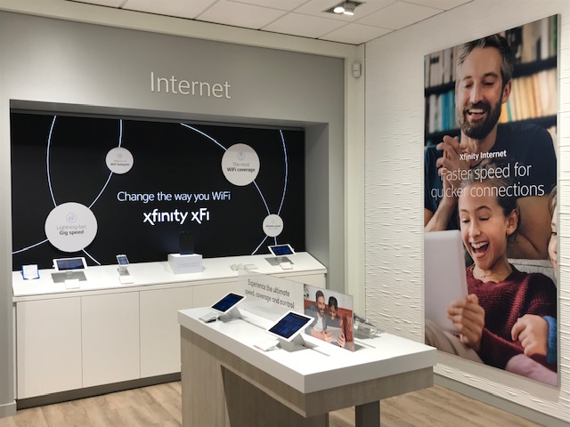 display inside Xfinity store that says "Change the way you WiFi."