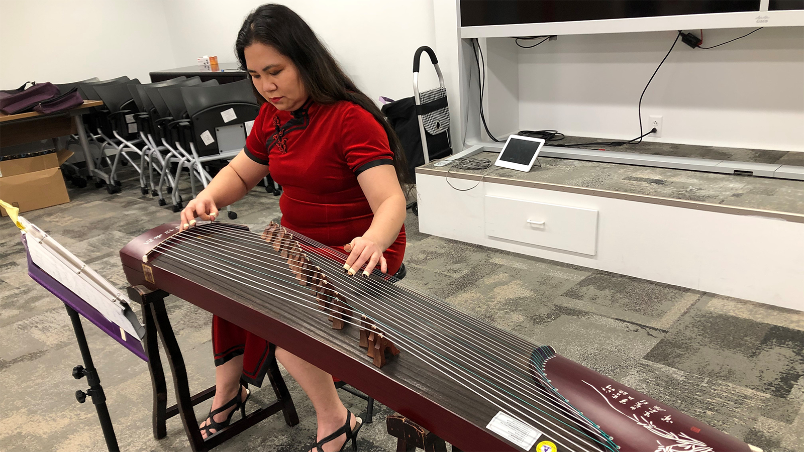 Comcast employee playing Chinese instrument