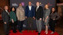 Senior leaders from Comcast on the red carpet at a private movie screening.