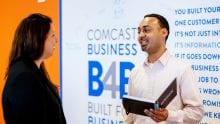 Comcast Business employee talking to business owner