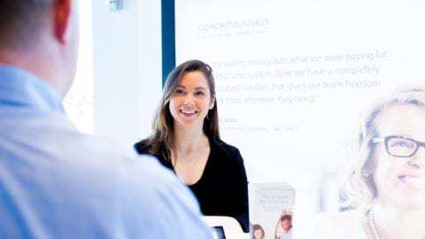 Woman speaking to Comcast Business employee