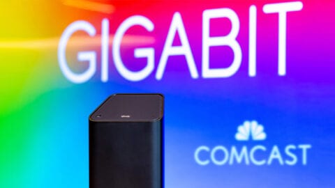 Xfinity gateway with Comcast logo and "Gigabit" in background