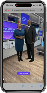 smartphone with augmented reality image of two people