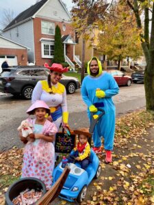 Two adults and two children dressed up for Halloween