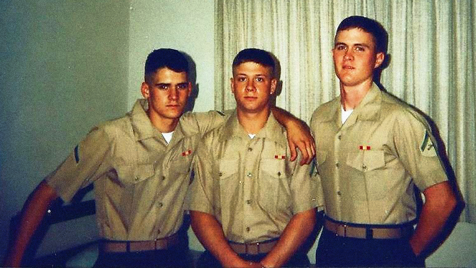 David Swisher stands next to his peers in the Marine Corps.