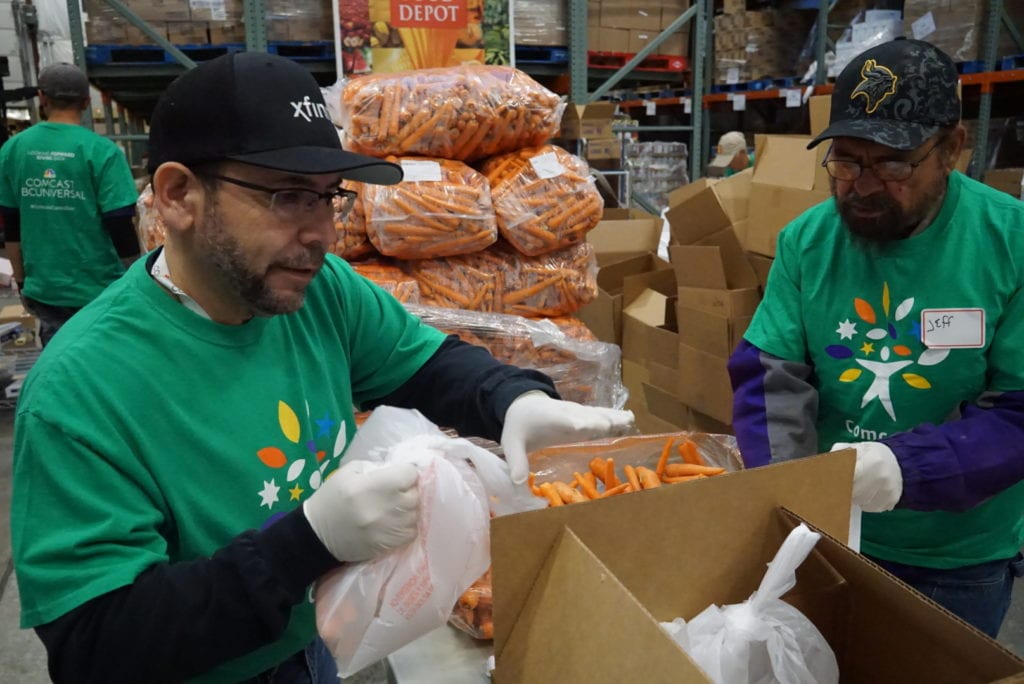 Spencer volunteering at the Santa Fe Food Depot on Comcast Cares Day in 2018